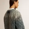 Chaqueta acolchada azul para mujer en denim de algodón con acabado desgastado Chaqueta acolchada azul para mujer en denim de algodón con acabado desgastado