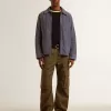 Chaqueta azul para hombre en algodón denim con tratamiento desgastado Chaqueta azul para hombre en algodón denim con tratamiento desgastado