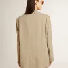 Chaqueta beige de rayas finas para mujer, de corte oversize y botonadura sencilla Chaqueta beige de rayas finas para mujer, de corte oversize y botonadura sencilla