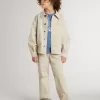 Chaqueta beige para niño con salpicaduras multicolores
