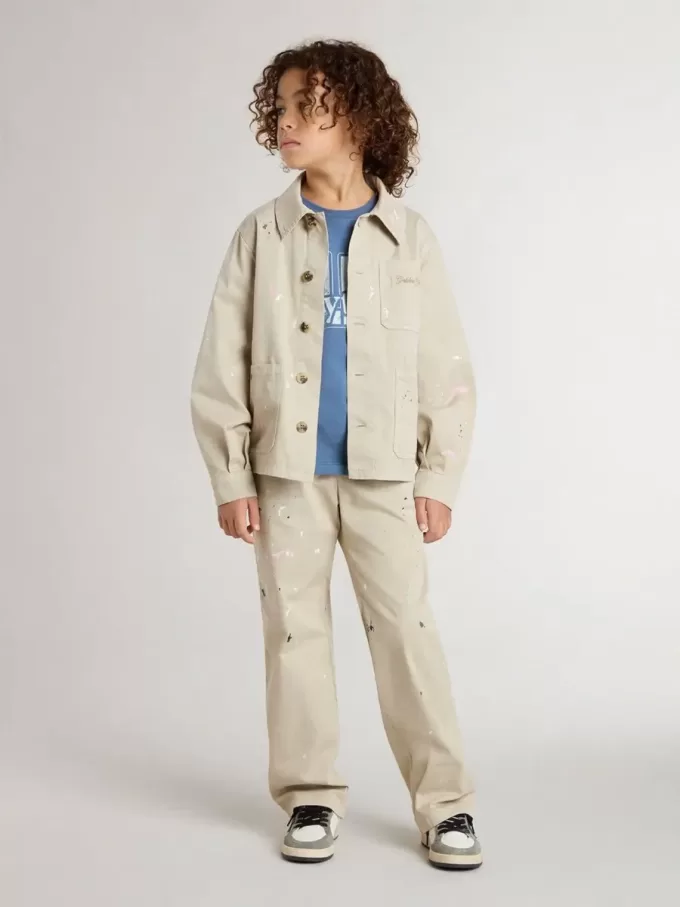 Chaqueta beige para niño con salpicaduras multicolores