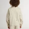 Chaqueta beige para niño con salpicaduras multicolores