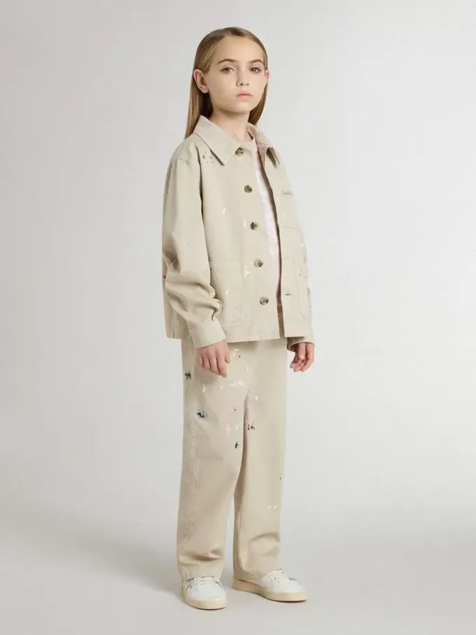 Chaqueta beige para niño con salpicaduras multicolores