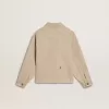 Chaqueta beige para niño con salpicaduras multicolores