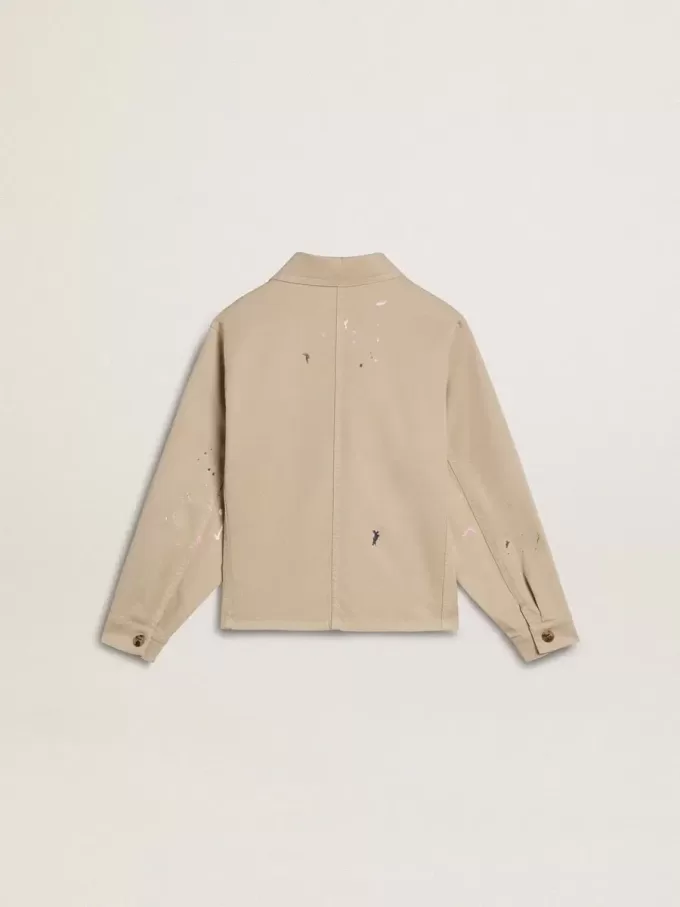 Chaqueta beige para niño con salpicaduras multicolores
