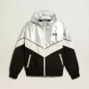 Chaqueta cortavientos para mujer en tejido técnico plateado y negro