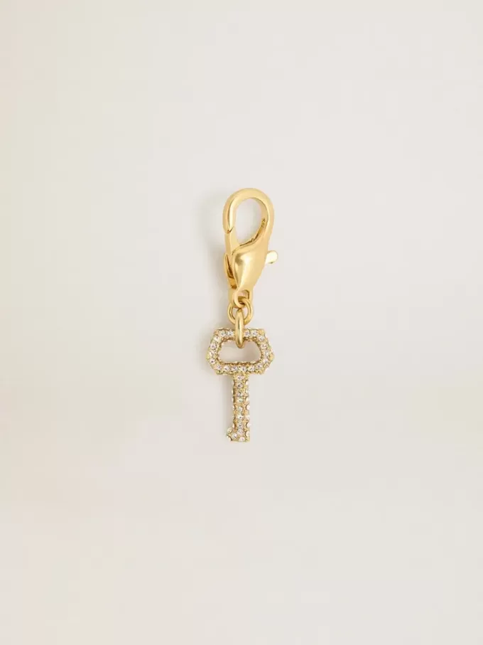 Colgante con forma de llave en latón dorado con cristales Colgante con forma de llave en latón dorado con cristales