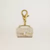 Colgante con forma de monedero en latón dorado con cristales Colgante con forma de monedero en latón dorado con cristales