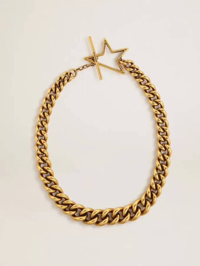 Collar con cadena decreciente en oro antiguo y cierre en forma de estrella Collar con cadena decreciente en oro antiguo y cierre en forma de estrella