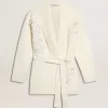Cárdigan de algodón color crema para mujer con bordado floral Cárdigan de algodón color crema para mujer con bordado floral