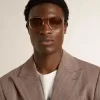 Gafas de sol estilo aviador con montura dorada y lentes beige Gafas de sol estilo aviador con montura dorada y lentes beige