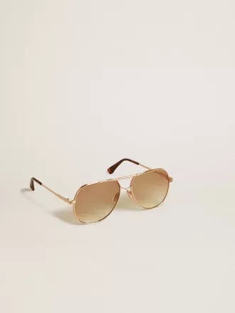 Gafas de sol estilo aviador con montura en oro rosa y lentes color miel