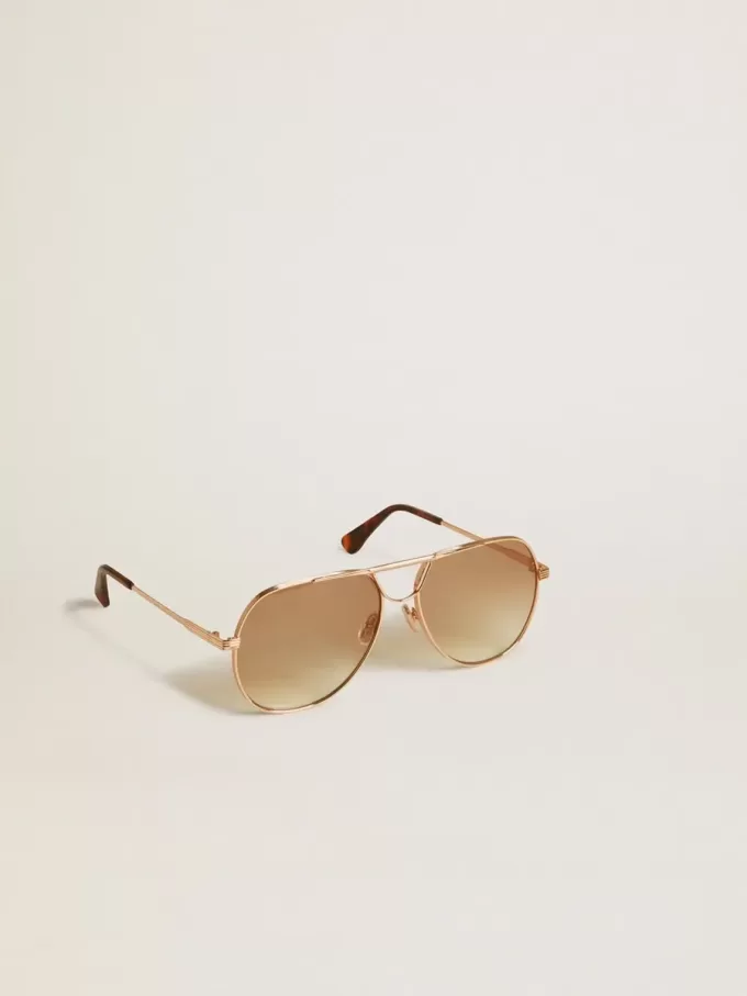 Gafas de sol estilo aviador con montura en oro rosa y lentes color miel