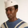 Gorro de lana blanco con estrella negra