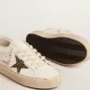 Hi Star LTD con estrella negra y dorada brillante y lengüeta dorada en el talón Hi Star LTD con estrella negra y dorada brillante y lengüeta dorada en el talón