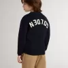 Jersey azul de cuello redondo para niño con las letras «Golden» en la espalda.