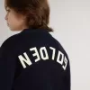 Jersey azul de cuello redondo para niño con las letras «Golden» en la espalda.