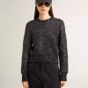 Jersey corto de mujer en mezcla de lana negra con lentejuelas por toda la prenda Jersey corto de mujer en mezcla de lana negra con lentejuelas por toda la prenda