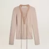 Jersey de lana beige con detalles de piel Jersey de lana beige con detalles de piel