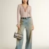 Jersey de lana beige con detalles de piel Jersey de lana beige con detalles de piel