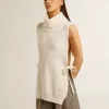Jersey unisex blanco de cuello alto y sin mangas en lana acanalada Jersey unisex blanco de cuello alto y sin mangas en lana acanalada