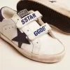 Junior Old School en piel blanca con estrella y lengüeta en el talón de ante azul Junior Old School en piel blanca con estrella y lengüeta en el talón de ante azul