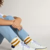 Junior Super-Star en piel blanca con lengüeta del talón en ante azul