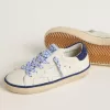Junior Super-Star en piel blanca con lengüeta del talón en ante azul
