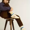 Junior Super-Star en piel napa con estrella beige y lengüeta azul en el talón