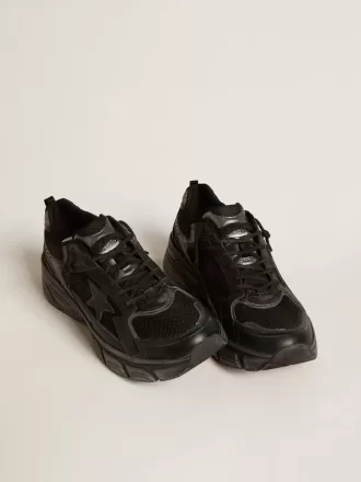 Lightstar para mujer con parte superior de cuero negro y malla y estrella negra