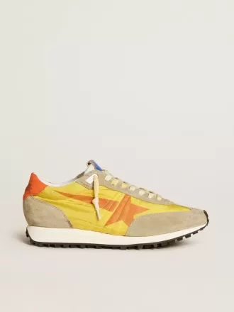 Marathon para hombre con parte superior de nailon amarillo y estrella naranja