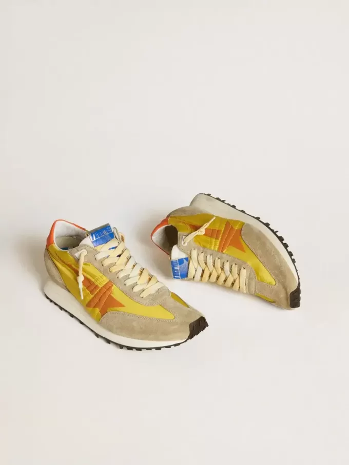 Marathon para hombre con parte superior de nailon amarillo y estrella naranja Marathon para hombre con parte superior de nailon amarillo y estrella naranja