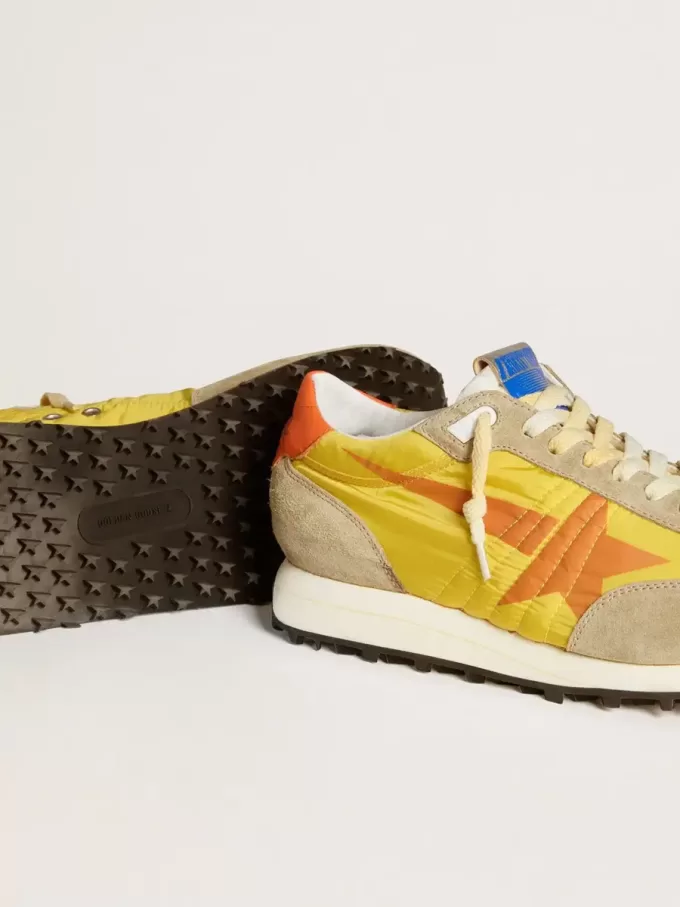 Marathon para hombre con parte superior de nailon amarillo y estrella naranja Marathon para hombre con parte superior de nailon amarillo y estrella naranja