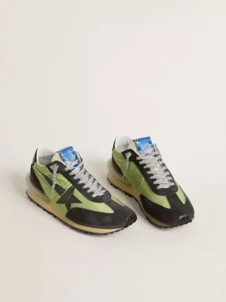 Marathon para mujer con parte superior de nailon verde y estrella negra