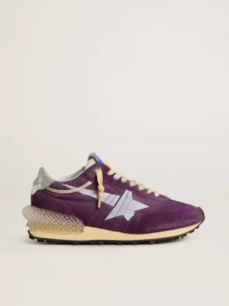 Maratón para mujer con parte superior de nailon morado y estrella blanca