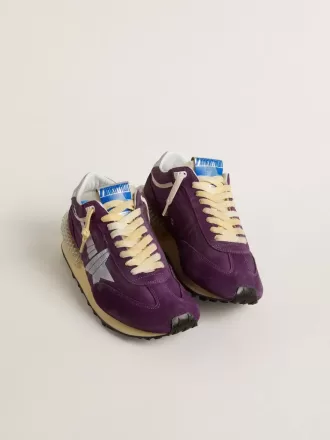 Maratón para mujer con parte superior de nailon morado y estrella blanca