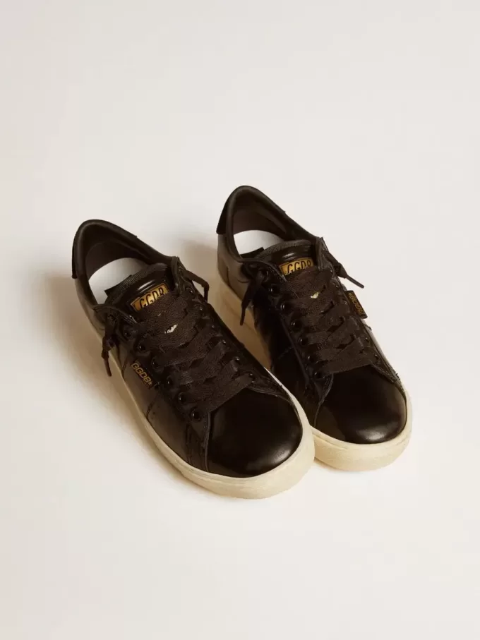 Matchstar para mujer en piel negra con lengüeta del talón en ante negro
