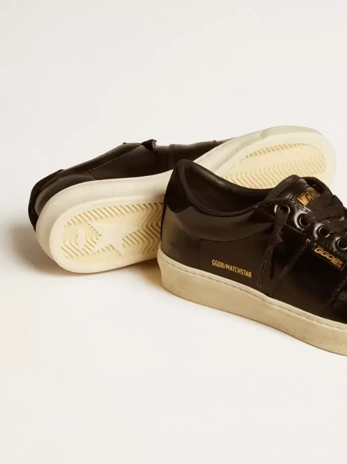 Matchstar para mujer en piel negra con lengüeta del talón en ante negro