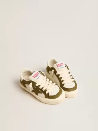 May Young en cuero blanco y verde militar
