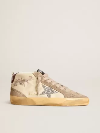 Mid Star para mujer en piel napa con bordado floral y estrella plateada brillante Mid Star para mujer en piel napa con bordado floral y estrella plateada brillante