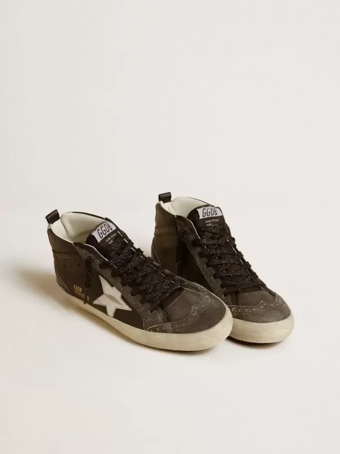 Mid Star para mujer en piel negra con estrella de piel metalizada plateada Mid Star para mujer en piel negra con estrella de piel metalizada plateada