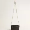 Mini bolso Star en piel negra con estrella tono sobre tono Mini bolso Star en piel negra con estrella tono sobre tono