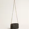 Mini bolso Star en piel negra con estrella tono sobre tono Mini bolso Star en piel negra con estrella tono sobre tono