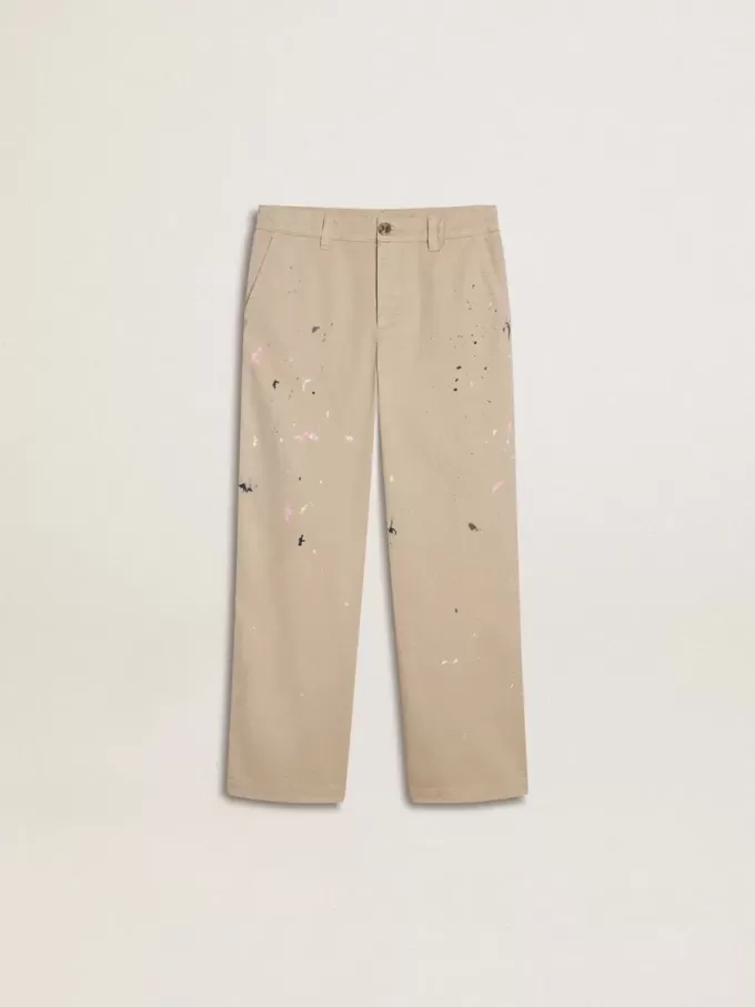 Pantalones chinos beige para niño con salpicaduras multicolores Pantalones chinos beige para niño con salpicaduras multicolores
