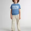 Pantalones chinos beige para niño con salpicaduras multicolores Pantalones chinos beige para niño con salpicaduras multicolores