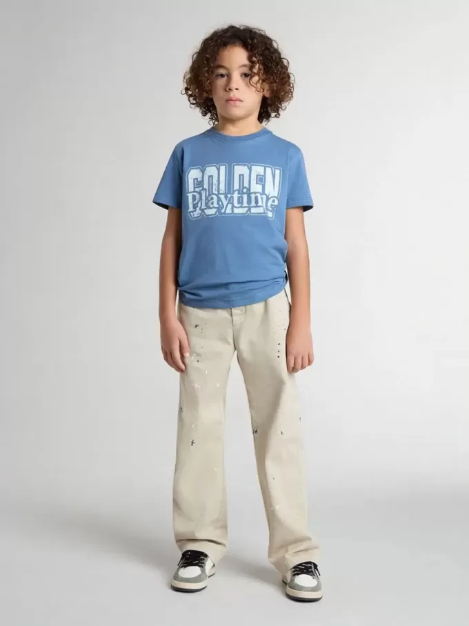 Pantalones chinos beige para niño con salpicaduras multicolores Pantalones chinos beige para niño con salpicaduras multicolores