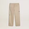 Pantalones chinos beige para niño con salpicaduras multicolores Pantalones chinos beige para niño con salpicaduras multicolores