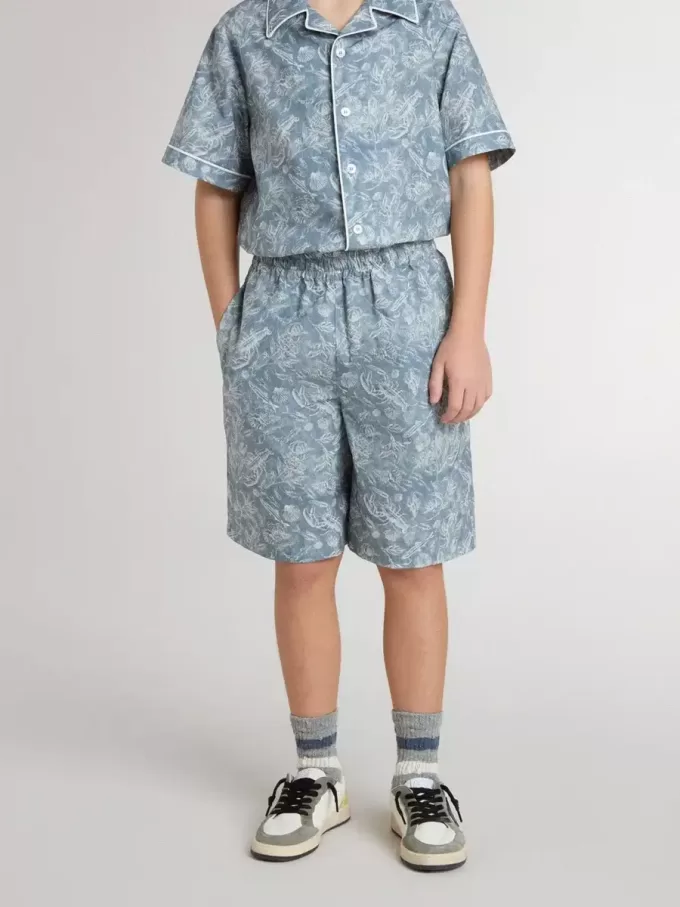 Pantalones cortos azules para niño con estampado blanco Pantalones cortos azules para niño con estampado blanco