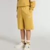 Pantalones cortos de jogging para niños en amarillo ocre con bordado Pantalones cortos de jogging para niños en amarillo ocre con bordado