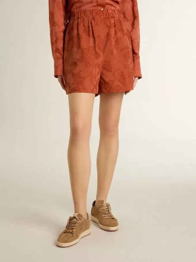 Pantalones cortos de mujer en jacquard rojo ladrillo con estampado floral marino